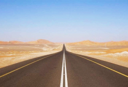 The World’s Longest Straight Road Pierces a Desert for 149 Miles without a Single Bend